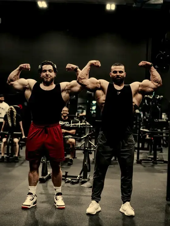 Justin and a training partner hitting a front double biceps
