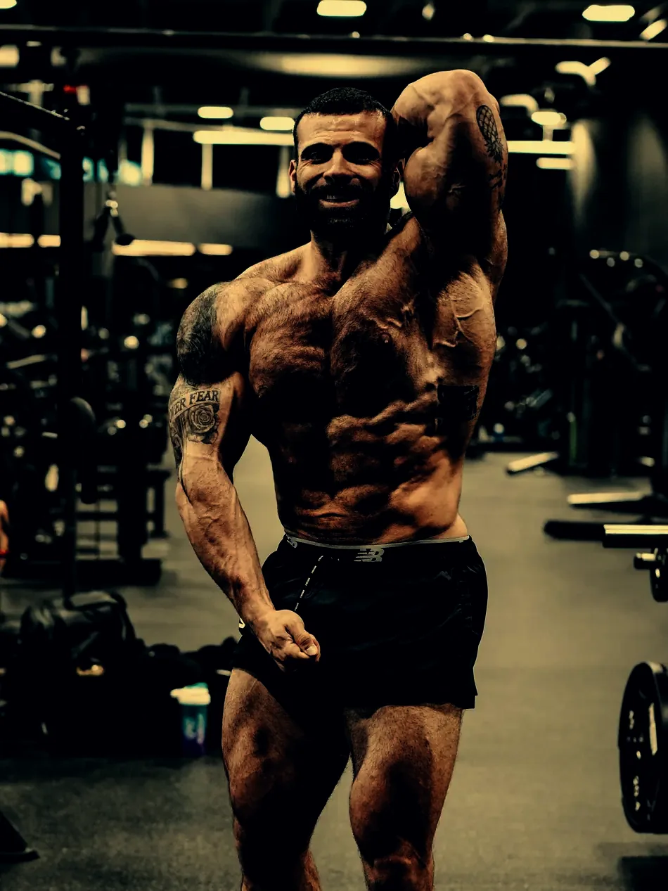 Justin holding a side triceps pose